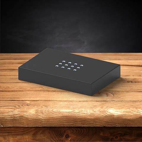A plastic black light base for 3D photo crystals.