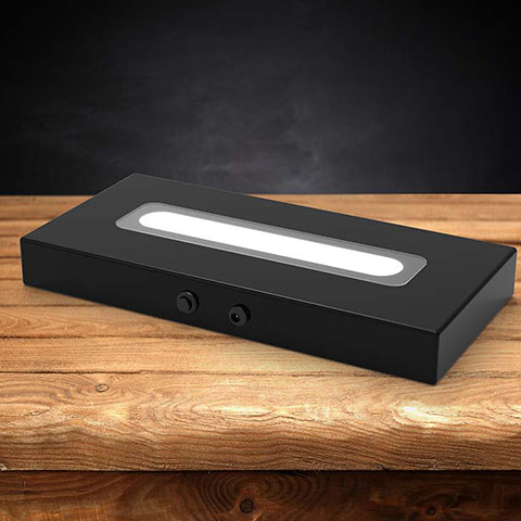 Wood LED light base with a dark background.